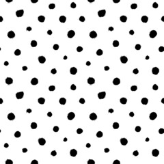 Polka dot grunge seamless vector pattern. Black circle brushstrokes and rough rounded shapes. Hand drawn abstract ink background. Circles, dots, splotches, blobs. Wallpaper design, textile print