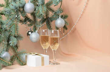 A New Year's composition on a background with flesh-colored waves.