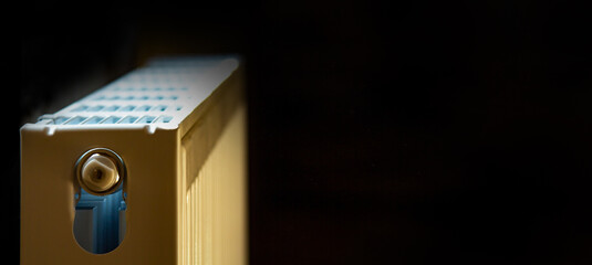 steel radiator on a black background. Place for your text. Selective focus