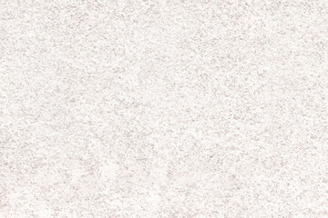 The mottled surface of the granite slab is finely speckled. Uniform texture of natural stone.