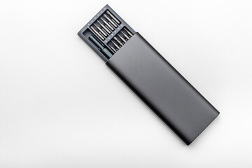 a set of small screwdriver bits in an open box