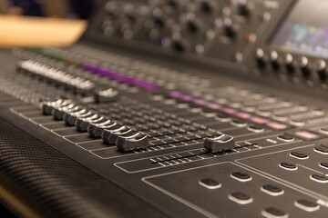 buttons equipment in audio recording studio. Professional concert mixing console is equipped with...