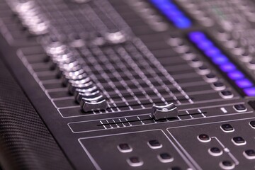 buttons equipment in audio recording studio. Professional concert mixing console is equipped with high-precision and long-stroke faders.