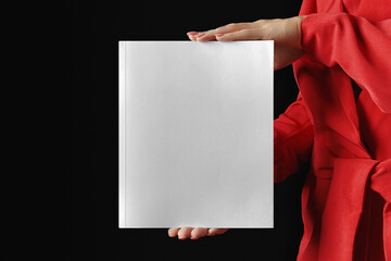 Woman in red presenting a book mockup