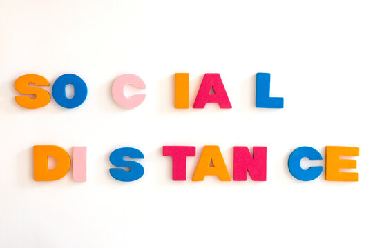 Word made up of multicolored letters. Social distance
