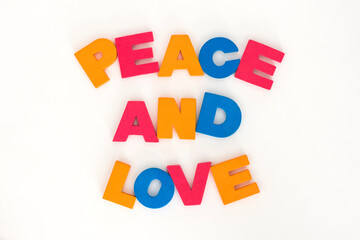 Word made up of multicolored letters. Peace and love