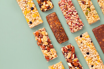 Granola bars.  Muesli. Healthy energy bars made of cereals, berries, nuts and fruits on a light...