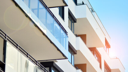 Fototapeta premium Modern apartment building on a sunny day. Architectural details and facade of a modern apartment building.
