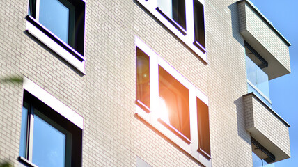 Modern apartment building on a sunny day. Architectural details and facade of a modern apartment building.