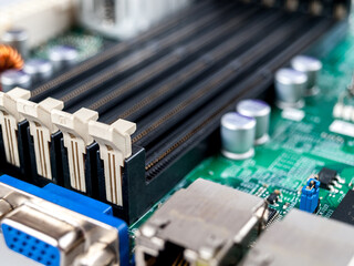 Slots, DIMM DDR connectors, connecting devices of RAM modules in the computer motherboard, close-up...