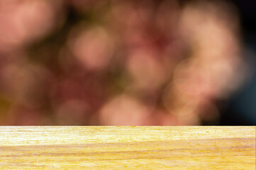 Wooden board empty table in front of pink bokeh abstract background
