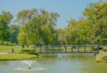 A beautiful landscape with a water fountain on the Pond in Aurora, Illinois
