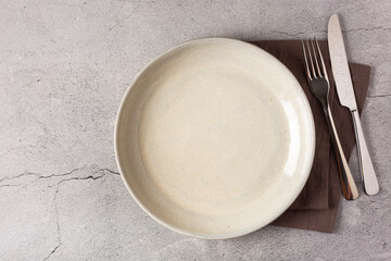 Empty plate on the slate table. Top view of the image.