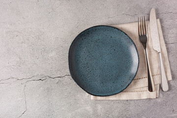 Empty plate on the slate table. Top view of the image.