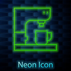 Glowing neon line Coffee machine icon isolated on brick wall background. Vector