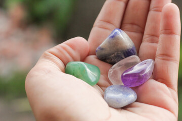 Hands holding crystal. Concept of occult symbolism and spiritual practice.