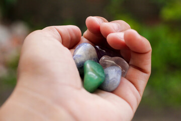 Hands holding crystal. Concept of occult symbolism and spiritual practice.