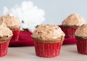 chocolate cupcake with red and white