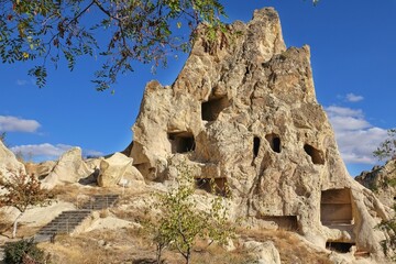 Travel to fairy Cappadocia.Scenery view to part of Goreme Open Air Museum with natural volcanic eroded tuff formation cliffs in national park Cappadocia valley, Nevsehir Province,Turkey.