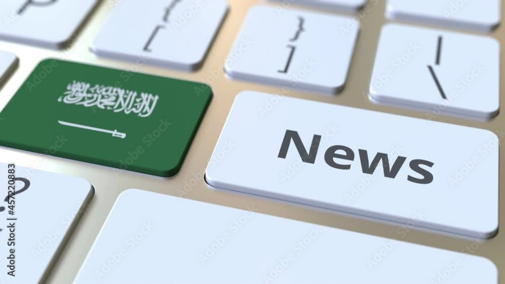 Poster news text and flag of saudi arabia on the keys of a computer keyboard. national online media related