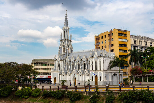 Beautiful church with a spring view, colorful trees and a river running through the city