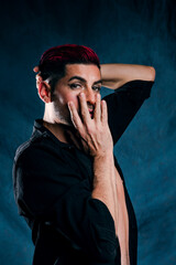 Portrait of extravagant androgynous model with short hair