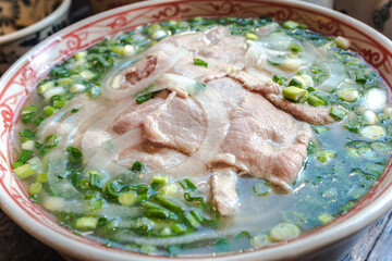 Vietnamese style rice noodles with a lot of beef.