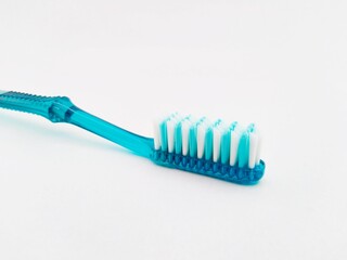 Used toothbrush on an isolated white background