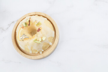 Lemon cake on marble table. Close up slice of citrus cake by classic recipe. Healthy nutrition, homemade vegan dessert.