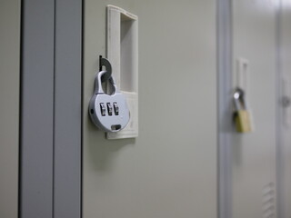 closeup of key number hanging on locker in locker room.