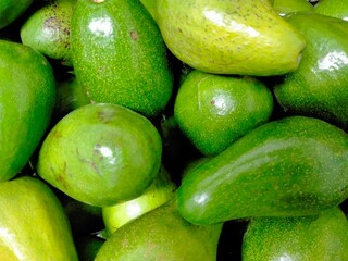 The group of avocado is displaying in the market