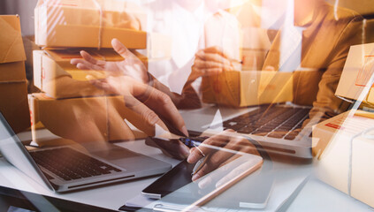 Young woman small business owner online shopping at home. taking note of orders from customers with mobile phones. SME entrepreneur or freelance life style concept.