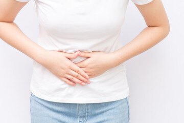 Young girl feels that her stomach is pain due to her period.