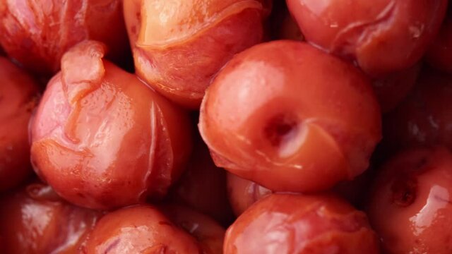 Canned cherry rotating on black background, drunken cherry dessert, tinned cherry spun, compote cherries