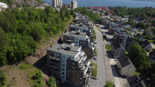 Heimans&aring;sen in slemmestad. Norwegian small town in the Oslo fjorden. The old norcem factory in the background. Calm village street.,