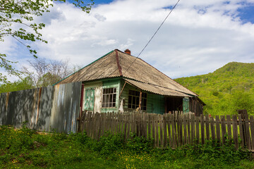 A chalet, a mountain village, an old style of architecture a variety of buildings and court buildings and fences.
