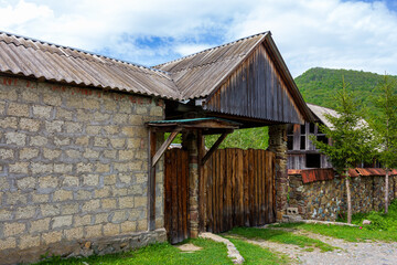 A chalet, a mountain village, an old style of architecture a variety of buildings and court...