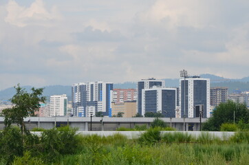 A city panorama with new buildings and stadium