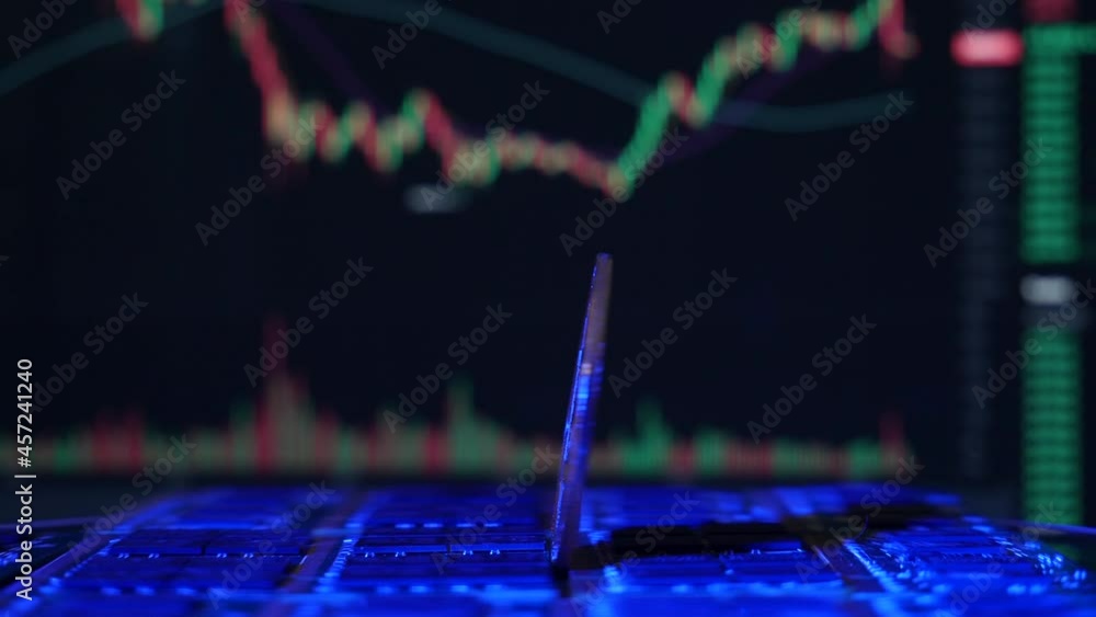 Aufkleber a bitcoin btc crypto currency coin rotating on a mining rig of computer chips with exchange charts i