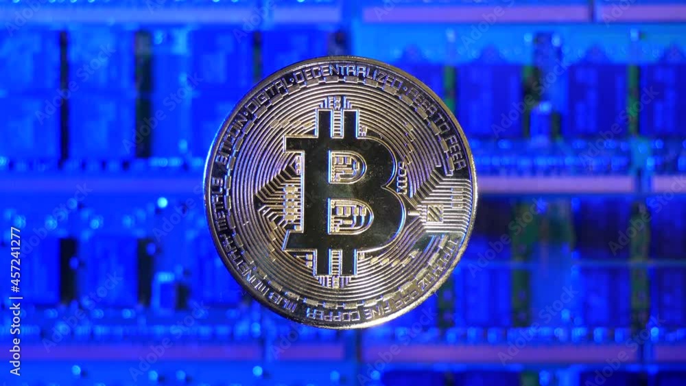 Poster a bitcoin btc crypto currency coin hovering over a mining rig of computer chips and electric energy 