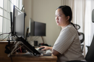 Asian woman is working on her working zone at home
