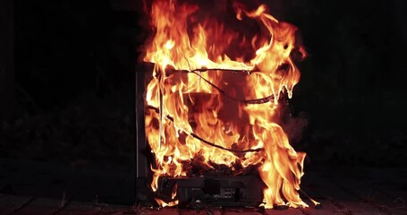 TV burning with broken screen - Powered by Adobe