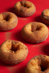 A pattern of freshly baked cinnamon donuts