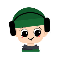 Avatar of a child with big eyes and a wide smile in a green hat with headphones. A cute kid with a joyful face in an autumnal or winter headdress and scarf. Head of adorable baby with happy emotions