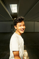 Fototapeta premium Portrait of happy joyful young man laughing and looking at camera