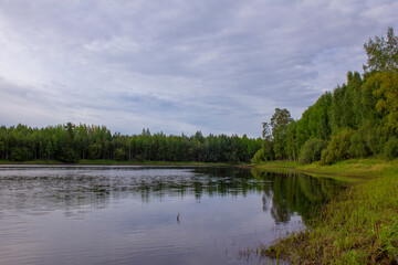 Siberian river landscape. Summer colorful landscape on the shore of a reservoir in Siberia.