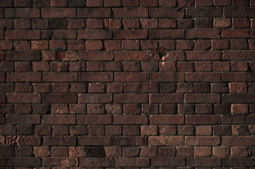 Grunge brown brick wall background. Retro brick wall texture backdrop.	