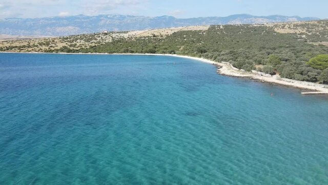 An aerial footage over Adriatic Sea on island Pag, Croatia near Mandre