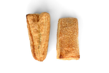Puff pastry bun (tongue) isolated on white background.