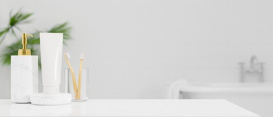 White tabletop with toothbrush, shampoo bottle, body lotion tube over bright white bathroom interior